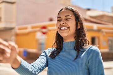 Young african american woman smiling confident standing at street