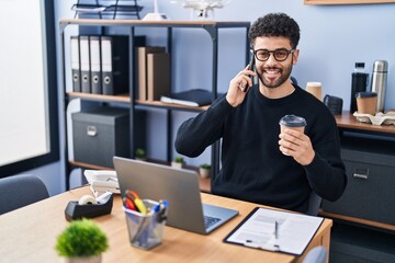 Young arab man business worker talking on the smartphone working at office