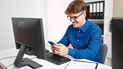 Young hispanic man business worker using smartphone smiling at the office