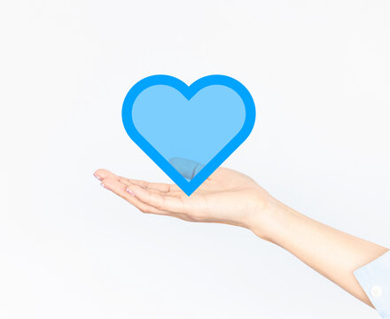 Woman hand palm facing upwards.Global internet connection technology.Business,digital marketing ,finance and banking,digital link technology, heart .AI controls technology futuristic,people and world