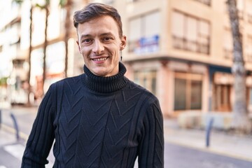 Young man smiling confident standing at street