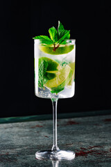 alcohol cocktail in a glass stands on a table in a bar or restaurant