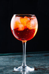 alcohol cocktail in a glass stands on a table in a bar or restaurant