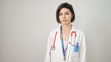 Young caucasian woman doctor standing with serious expression over isolated white background