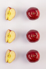 Red apples with slices isolated on a white background.