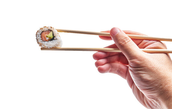 Hand of man holding california roll with chopsticks over isolated white background