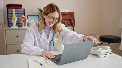 Young beautiful hispanic woman doctor having online medical consultation at clinic