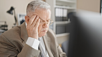 Fototapeta premium Middle age grey-haired man business worker using computer suffering for headache at office