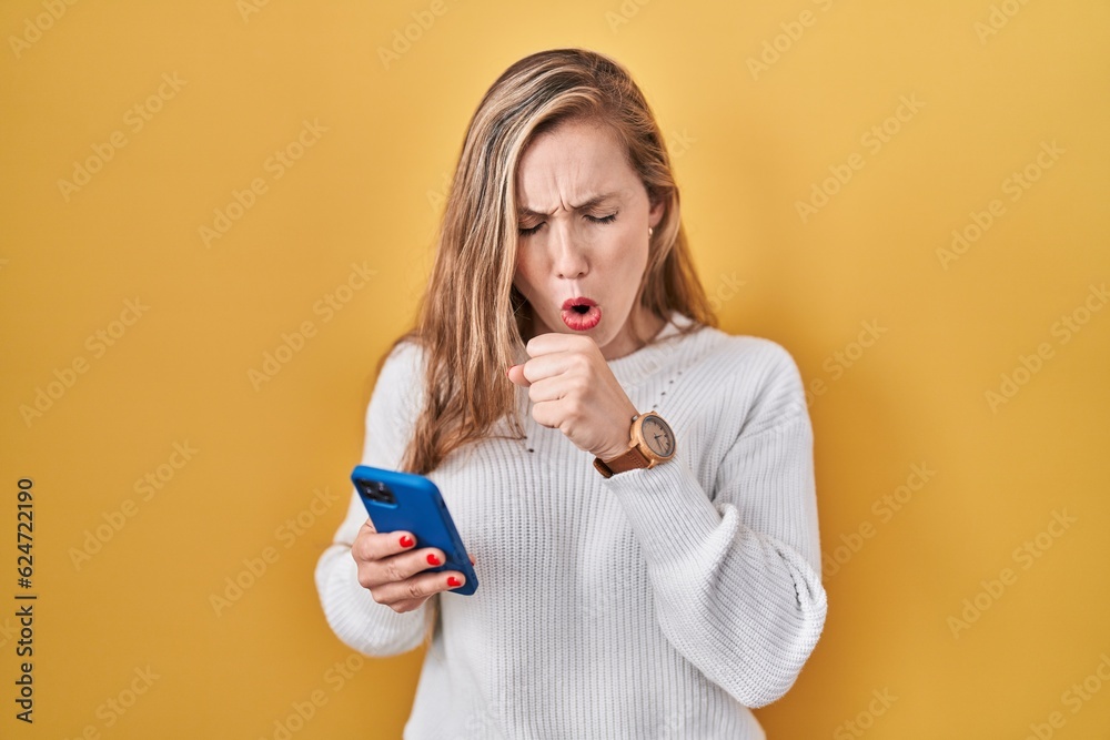 Canvas Prints young blonde woman using smartphone typing message feeling unwell and coughing as symptom for cold o