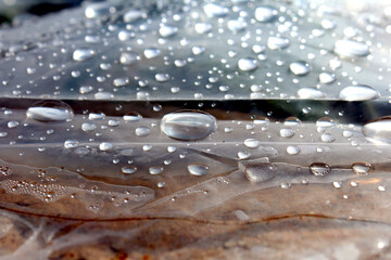some rain drops laying on plastic foils
