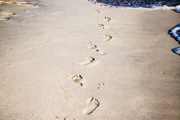 footsteps in golden sand texture summer fun