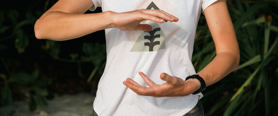 woman doing qigong on beach