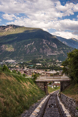 Landscape of Swiss Alps. Mountain, Sierre city, bridge and funicular trail in Switzerland. Crans Montana, Valais Canton, Switzerland.