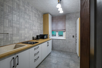 interior of modern luxure kitchen  in studio apartments with cupboard