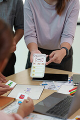 Close up of developer and ui designer brainstorming interface wireframe design.Creative digital...