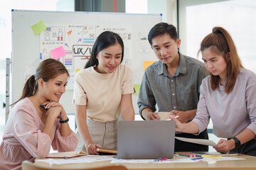 Young developer and ui designer brainstorming interface wireframe design.Creative digital development agency