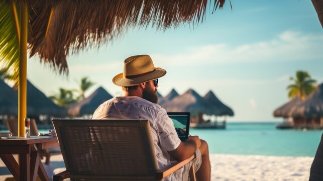person on the beach with laptop