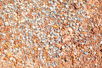 Small round stones background. Stone texture. Rough surface of small pebble stone.