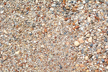 Small round stones background. Stone texture. Rough surface of small pebble stone.
