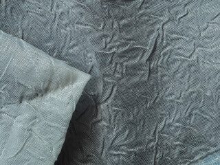 abric texture, material with visible weave and pattern, in light and shadow. background wallpaper for various projects