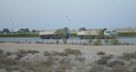 Trucks in in Wadi Al Buhair before construction works