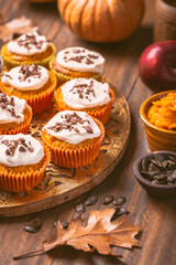 Spicy pumpkin muffins or cupcakes with cream cheese frosting