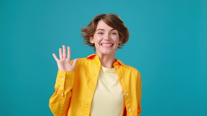 Woman waves hands in greeting and attracts attention