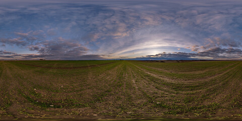 spherical 360 hdri panorama among farming field with clouds on evening blue sky after sunset in equirectangular seamless projection, as sky dome replacement in drone panoramas, game development