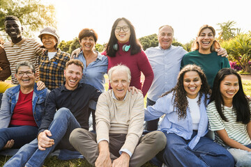 Group of multigenerational people smiling in front of camera - Multiracial friends of different...