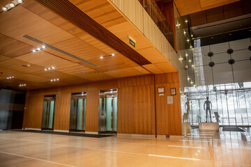 modern hotel interior with sophisticated lobby design, elevators, convenience, classy and lavish...