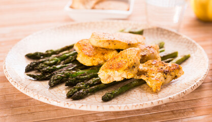 dietary meal rich in protein. Stir fried chicken breast and green asparagus