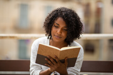 young woman writing in book