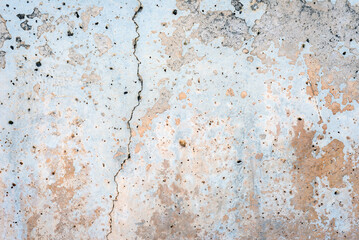 Cracked old grey dirty plastered wall abstract background
