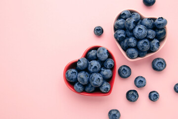 Yummy fresh blueberries in a red and pink shaped heart bowl