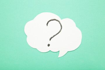 Question mark speech bubble on mint background.