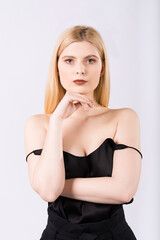 Close-up portrait of a young and elegant girl on a white background.