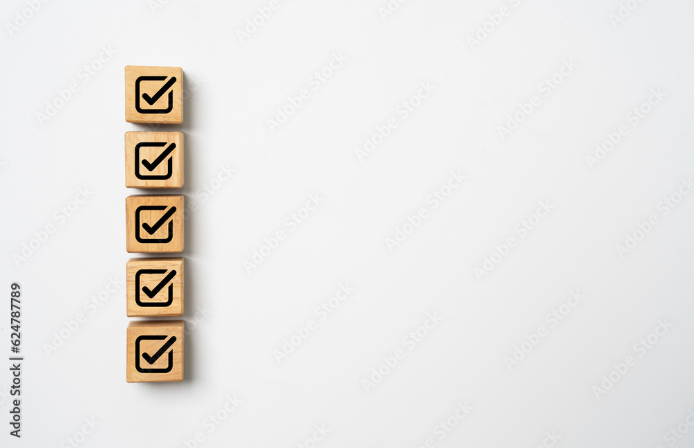 Poster Correct sign symbol on wooden block cube with white copy space background for approve document and project concept.