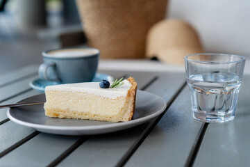 Yummy classic cheesecake and coffee on background