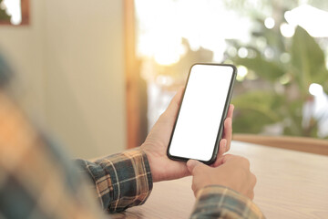 cell phone blank white screen mockup.hand holding texting using mobile on desk at office.background empty space for advertise.work people contact marketing business,technology