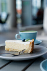 Yummy classic cheesecake and coffee on background. Delicious breakfast