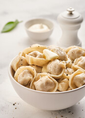 Dumplings, filled with meat, ravioli. Homemade meat dumplings - russian pelmeni.  Dumplings with filling. Close-up