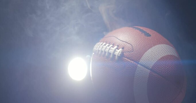 Football ball in studio with smoke anamorphic 4K