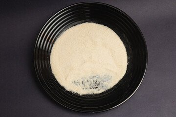 wheat, fine wheat bran, plate, black background, generated with extruder machine
