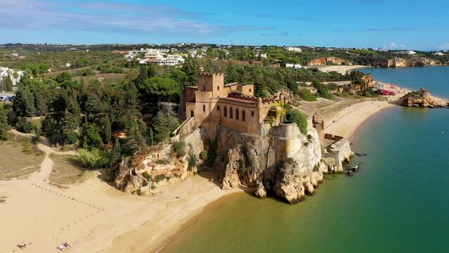 The Fort of Sao Joao do Arade (Castle of Arade) in Ferragudo Village, Algarve. Beach and castle Sao Joao do Arade in Ferragudo in the Algarve in Portugal.