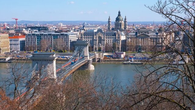 Blue river with secheni bridge. A calm blue Danube river with Secheni bridge against Budapest famous places of interest in the day light.