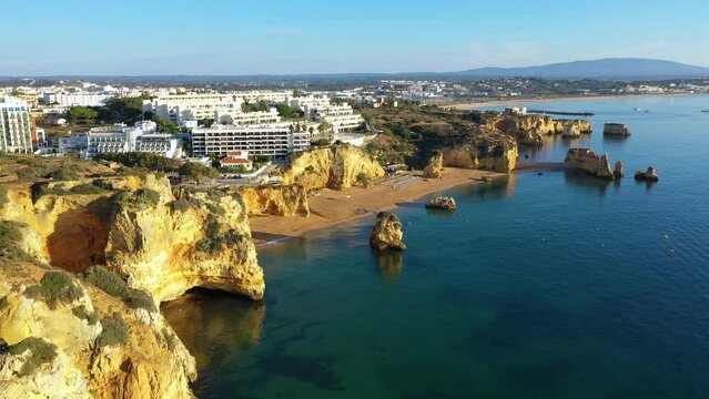 Praia de Dona Ana beach with turquoise sea water and cliffs, Portugal. Beautiful Dona Ana Beach (Praia Dona Ana) in Lagos, Algarve, Portugal. Praia de Dona Ana in Lagos in the Algarve, Portugal.