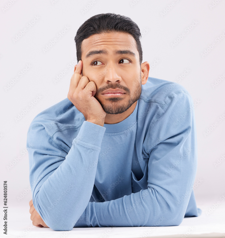 Aufkleber thinking, remember and young man in a studio resting on his arms with a contemplating facial express