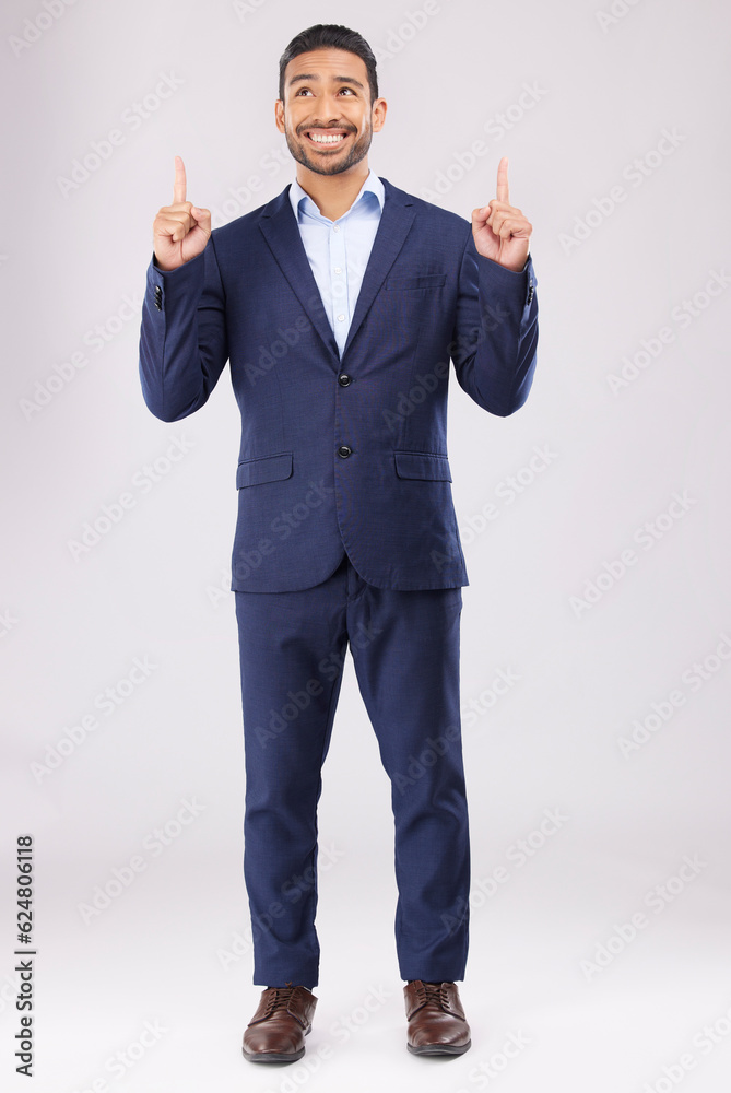 Poster happy, pointing and presentation with business man in studio for idea, advertising and news. solutio