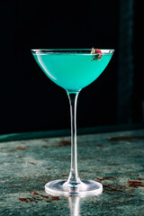 alcohol cocktail in a glass stands on a table in a bar or restaurant