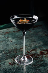 alcohol cocktail in a glass stands on a table in a bar or restaurant